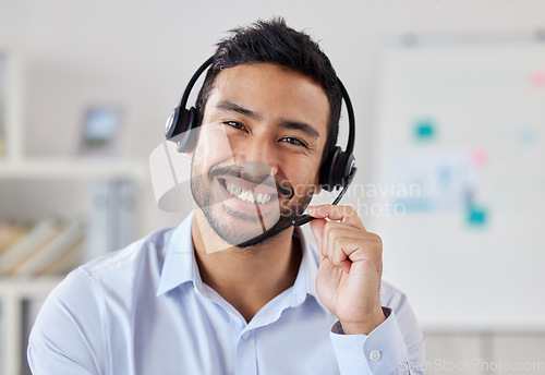 Image of Portrait, call center and Asian man smile for telemarketing, customer service or technical support. Face, contact us and sales agent, crm consultant and person from Singapore working at help desk.