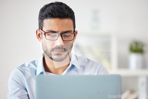 Image of Laptop, business man and accountant in office, workplace or company. Computer, working and Asian male professional, entrepreneur or auditor work on accounting, reading email or focus on web research