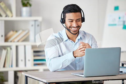 Image of Laptop, customer service and remote work with a man consultant in his home office for support or help. Computer, call center and contact us with a male employee consulting for crm or telemarketing