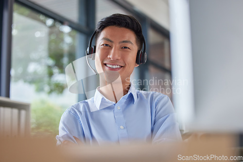 Image of Call center, smile and portrait of business man in office for consulting, contact us and telemarketing. Communication, customer service and help desk with Asian employee for receptionist and advice