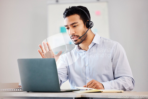 Image of Call center, laptop or man consulting on video call with headset greeting in customer services or support. Wave, telemarketing virtual assistant or Asian sales consultant speaking or talking online