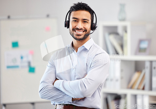 Image of Arms crossed, portrait or happy man in call center tech support consulting, speaking or talking in telemarketing. Communication, face or friendly consultant smiling in telecom sales with microphone