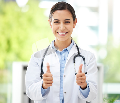 Image of Thank you, portrait of woman with thumbs up and smile at the hospital outdoors. Success or motivation, review or support and happy female nurse with hand emoji for health wellness or achievement