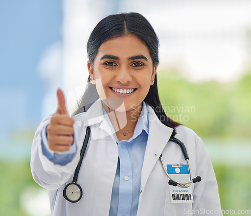 Image of Woman, doctor portrait and thumbs up with hospital success, motivation and yes in clinic. Emoji, winner and like hand sign of a professional healthcare and wellness worker feeling happy from job