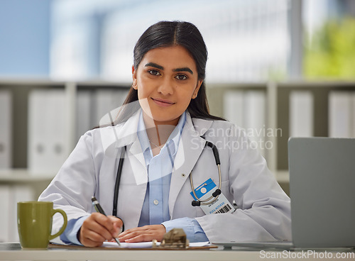 Image of Medical, focus and portrait of doctor in office for consulting, report and paperwork. Medicine, healthcare and checklist with woman writing in hospital for prescription, wellness exam and results