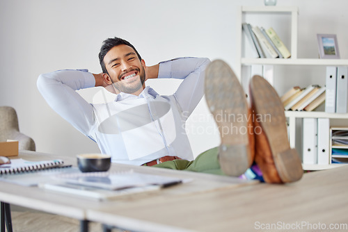 Image of Relax, happy and portrait of business man at desk for pride, stretching and break. Smile, achievement and inspiration with male employee in office for mental health, professional and satisfaction