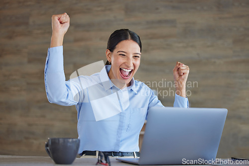 Image of Happy woman at desk with laptop, excited for good news, promotion or winning deal on email in office. Happiness, celebration and success, online trader at start up and winner feedback on bonus stocks