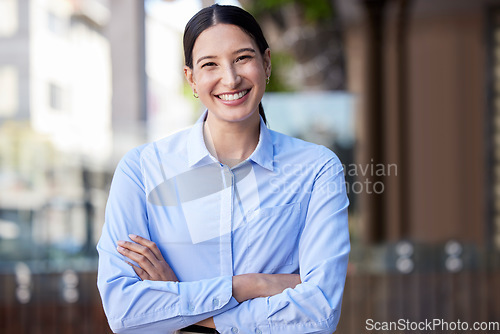 Image of Business woman, portrait smile and arms crossed in confidence for small business management in city. Happy and confident female person or creative employee smiling for startup or goals in urban town