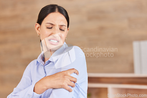 Image of Business woman, arm pain and stress with sore shoulder, broken bone or discomfort at office. Frustrated and tired female person or employee holding painful area, inflammation or joint at workplace