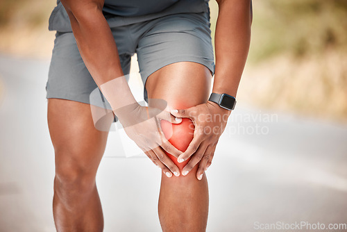 Image of Fitness, knee pain and accident with a sports man outdoor in nature for cardio or endurance running. Exercise, medical or anatomy injury with a male athlete holding a joint while training for health