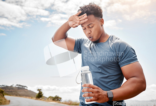 Image of Fitness, outdoor and black man drinking water, tired and exercise with wellness, health and cardio training. Male person, guy or athlete outside, resting and liquid with practice, sweating and sports