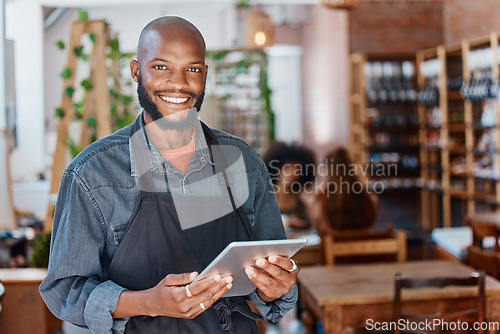 Image of Restaurant, tablet and portrait of man or small business owner, e commerce and cafe or coffee shop management. Happy waiter or african person with sales on digital technology or internet for startup