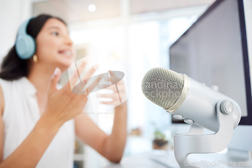 Image of Audio, microphone or woman live streaming a podcast media or online radio on broadcast network. Influencer host, blurry presenter or girl journalist reporter talking, recording or speaking of news