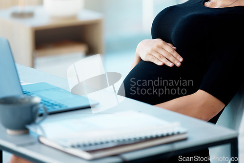 Image of Business woman, pregnant and hand on stomach in office with hope, love and future at finance company. Businesswoman, accounting and pregnancy at desk with self care, schedule and touching abdomen