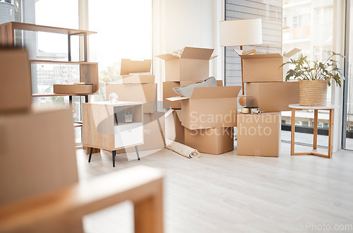 Image of Moving, new home and cardboard boxes for packing house with furniture, living room decorations and apartment space. Household, packed box and empty property to rent, buy or own with modern interior