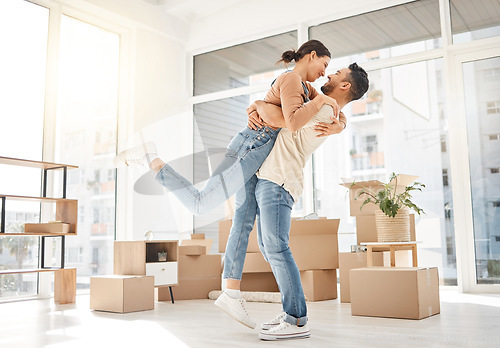 Image of Happy, moving and hug with couple in new home for celebration, property and relocation. Excited, love and real estate with man and woman in living room apartment for investment, rent and homeowner