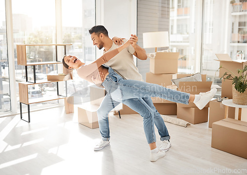 Image of Celebration, dance and couple with boxes, property and excited with rent apartment, mortgage and home. Cardboard, man and woman dancing, real estate and moving with love, quality time and romance