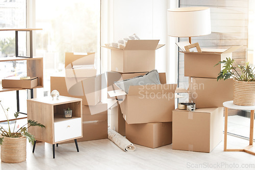 Image of Cardboard, moving boxes and packing house with furniture, living room decorations and apartment space. Household, packed box and empty property to rent, buy or new home with modern interior