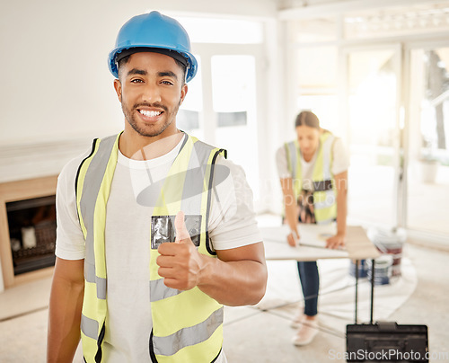 Image of Portrait of man, construction and home renovation with thumbs up, helmet and smile in apartment. Yes, positive mindset and diy renovations, happy handyman in safety and building project in new house.