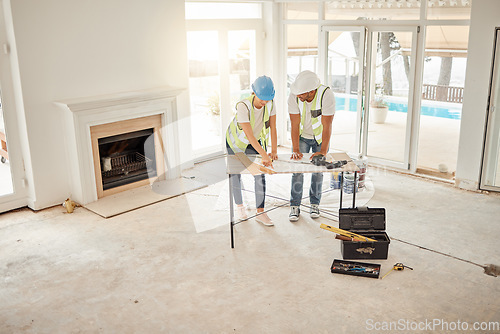 Image of Architect, construction and home renovation team at table for maintenance or architecture. Engineer man and woman talk and planning strategy with handyman tools for teamwork and collaboration project