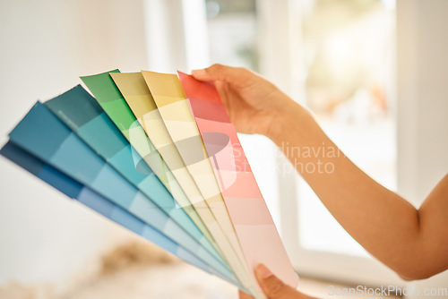 Image of Woman, hand and choice for wall with colour for interior design for creativity at a house in a closeup. Renovation, interior design and paint chart for home with creative thinking by designer.