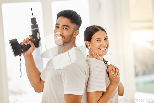 Image of Couple, working and portrait with construction tools, maintenance equipment and house decoration or renovation. People, back together and smile for home building, interior design or diy project