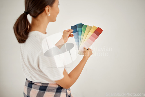 Image of Renovation, woman and wall colours with chart at home with creativity for interior design. Female designer, thinking and colour card for paint for a house with guide for idea with maintenance.