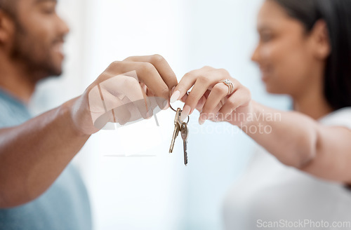 Image of House, key and hands of couple in new home for property, apartment and real estate investment. Relationship, homeowner and closeup of man and woman with keys for relocation, move and moving day