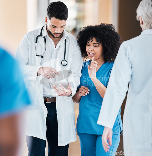 Image of Tablet, medical and doctor and nurse planning schedule online, internet and web together in a hospital or clinic. Strategy, healthcare and professional or team working together on a medicine app