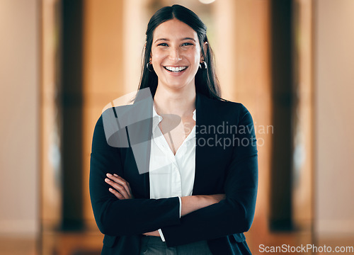 Image of Portrait, smile and arms crossed with a corporate business woman in her professional workplace. Happy, mindset and confident with a happy female employee standing in her office wearing a power suit