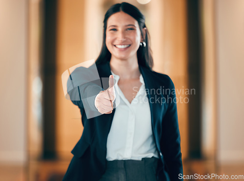 Image of Portrait, smile and thumbs up with a professional business woman in her corporate workplace. Happy, motivation and confident with a happy female employee standing in her office wearing a power suit