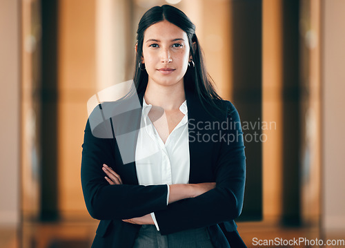 Image of Business, woman and arms in a serious portrait at the office for career as entrepreneur in company. Female professional, focus and face with arm as leader in a workplace for job with employee.