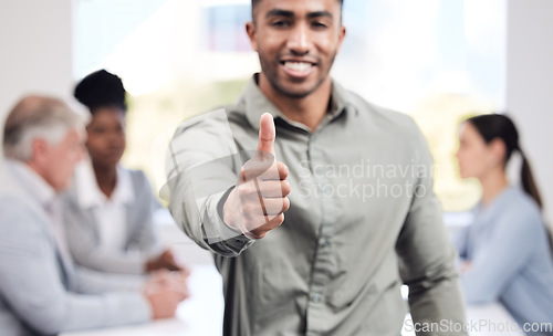 Image of Portrait, hand and a business man thumbs up in the boardroom with his team planning in the background. Leadership, workshop and motivation with a happy male employee showing support in the office