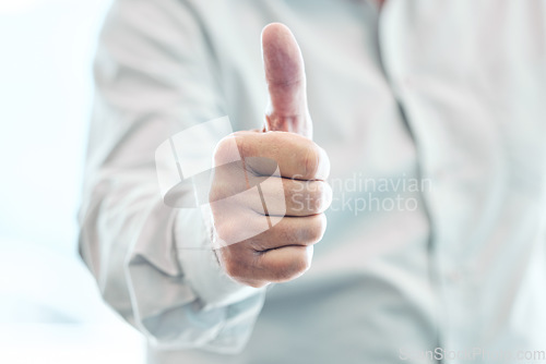 Image of Businessman, hand and thumbs up for winning, approval or corporate success at the office. Hands of man with thumb emoji, yes sign or like for achievement, agreement or thank you at the workplace
