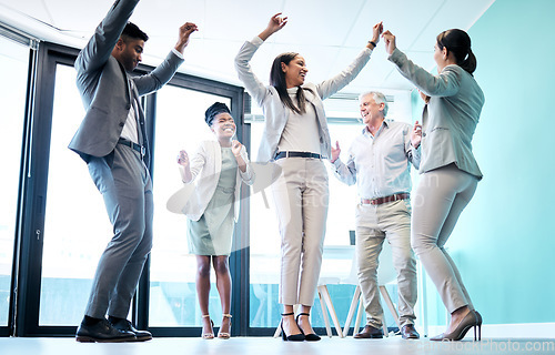 Image of Business people, diversity and dancing in office for team building, celebration or corporate event. Happy group of employees dance in fun teamwork, collaboration or winning together at the workplace