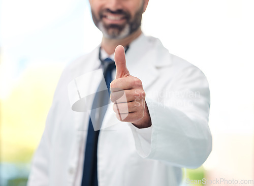 Image of Thumbs up, success and happy doctor for healthcare support, thank you or excellence for hospital services. Health, medical professional or person like, yes and ok hand or emoji for winning or results