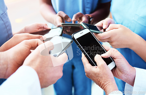 Image of Phone, team hands and doctors for contact us, communication and workflow or teamwork online. Medical, healthcare and circle of surgeon, nurses or group of people typing on smartphone for web 3.0 chat