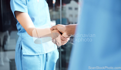 Image of Hand, doctor and nurse handshake in hospital for medical, healthcare or surgery teamwork or partnership welcome. Thank you, health care doctors in consultation and workers shaking hands in meeting