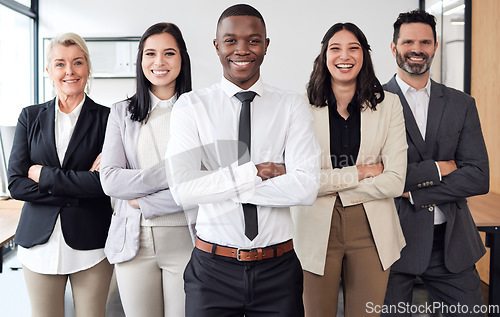 Image of Success, crossed arms and team of business people in the office for teamwork, collaboration and diversity. Happiness, smile and professional employees standing with corporate manager in the workplace