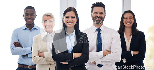 Image of Portrait, management and arms crossed with a business team standing together in their professional office. Collaboration, teamwork and leadership with a group of colleagues looking confident at work