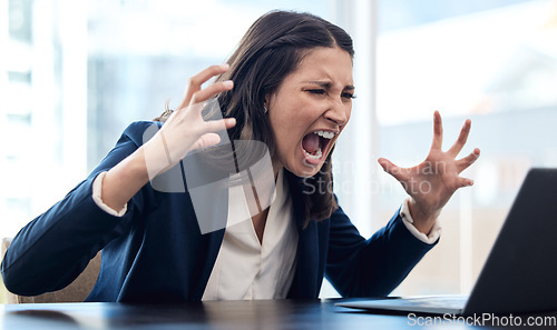 Image of Business, woman and angry is shouting at computer with a problem or frustrated at company with entrepreneur. Female professional, anger and laptop with screaming, stress at office with online work.
