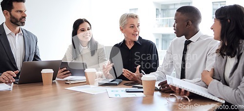 Image of Business people, meeting and professional team talking in a corporate office for brainstorming. Diversity men and women at a table for planning, discussion and strategy with technology and ideas