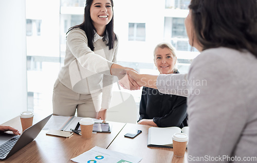Image of Meeting, handshake and thank you with business women in the boardroom for a b2b partnership or deal. Welcome, planning and support with happy female colleagues shaking hands in agreement at work