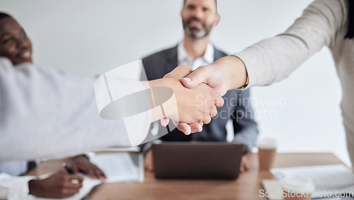 Image of Meeting, handshake and closeup with business women in the boardroom for a b2b partnership or deal. Thank you, support and welcome with colleagues shaking hands in agreement while planning at work