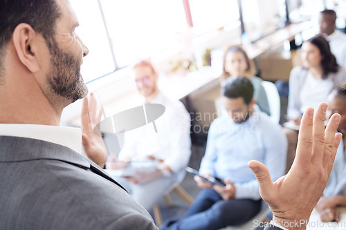 Image of Presentation, speaker hands and business people in audience at a conference, seminar or corporate workshop. Professional presenter man talk or speech for crowd at convention, training or trade show