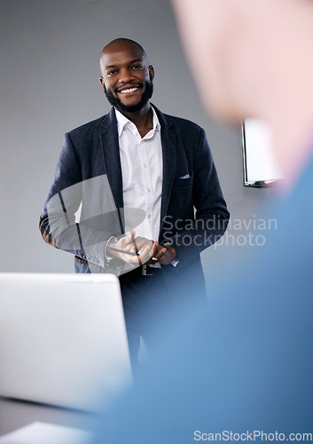 Image of Meeting, presentation and coaching with a business black man in the boardroom for a training workshop. Management, education and planning with a young male speaker in he office during a seminar