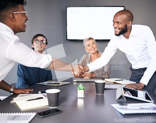 Image of Business people, handshake and meeting for partnership, deal or b2b agreement together at office. Businessman shaking hands for teamwork, collaboration or welcome in hiring or recruiting at workplace