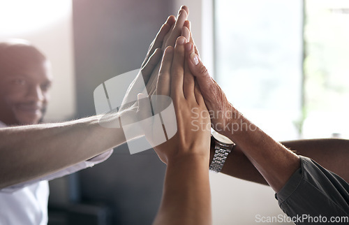 Image of Group, business people and high five for motivation with teamwork, synergy or diversity at insurance agency. Businessman, hands and goal with happiness for team building, solidarity and collaboration