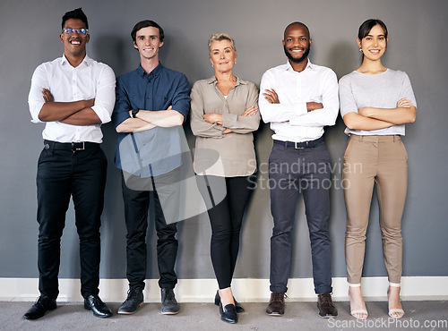 Image of Group portrait, business people and arms crossed by wall with teamwork, smile and diversity at insurance agency. Men, women and together with happiness for team building, solidarity and collaboration