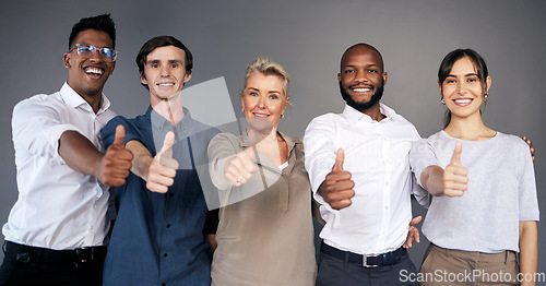 Image of Group portrait, business people and thumbs up by wall with teamwork, smile or diversity at insurance agency. Men, women and hand emoji with sign for team building, solidarity or agreement in office